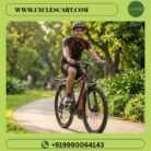 Young cyclist riding Avon Gamer Apex 26T geared bicycle on sunny park pathway | Cyclescart