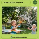 Joyful young boy waving the blue smiley bubble wand producing dense clusters of floating bubbles in the backyard | Cyclescart