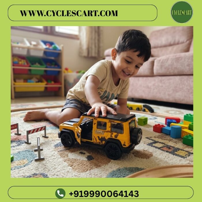 toddler-playing-yellow-g-wagon-metal-pull-back-car Young boy playing happily on floor mat with heavy alloy G-Wagon pull back toy car | Cyclescart